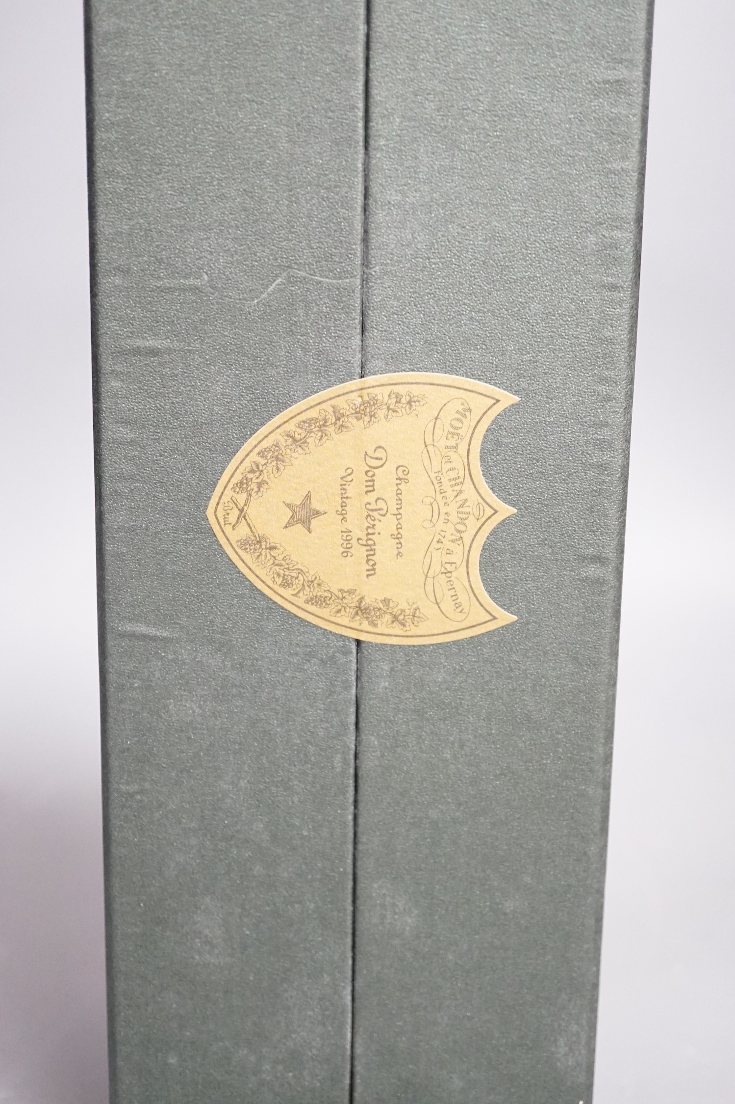A cased bottle of Dom Perignon 1996 Champagne.